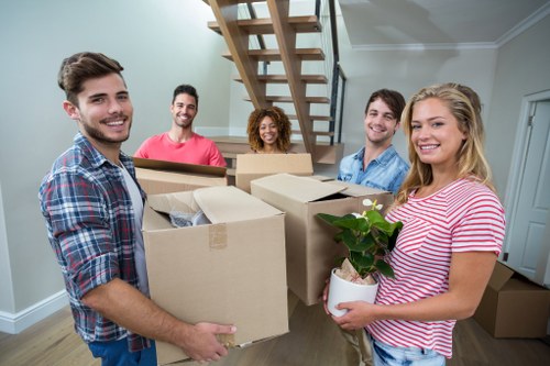 Moving boxes and wrapped furniture during removals in St John’s Wood