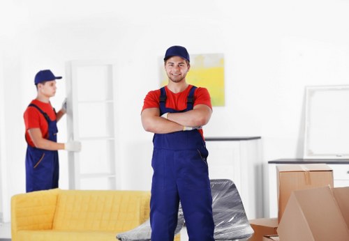 Insured movers handling furniture carefully during a relocation