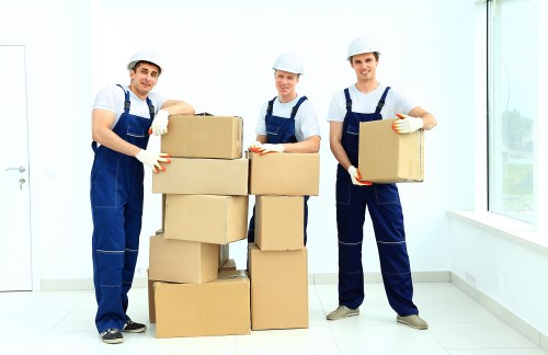 Staff handling furniture carefully during a removal operation