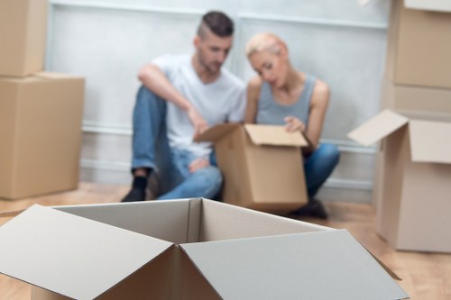 Careful furniture handling during an apartment move in Stjohnswood