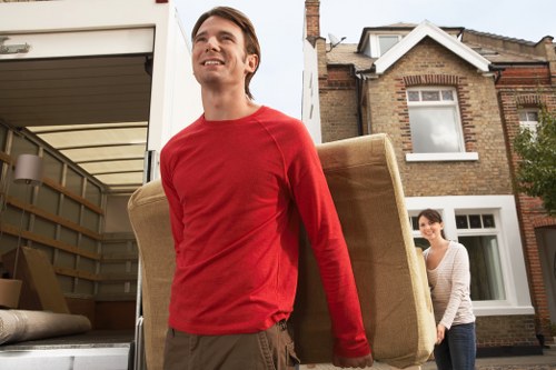 Team collecting bulky household furniture from a local property