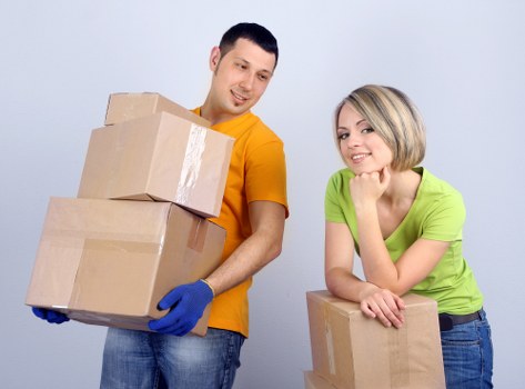 Professional movers handling packed items with care