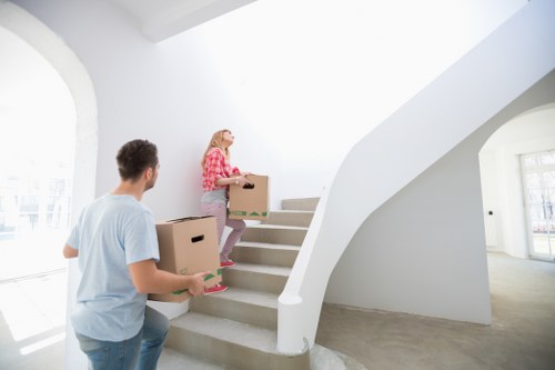Professional removals service handling items in a London home