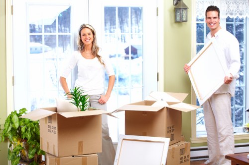 Movers navigating a staircase in a St Johns Wood apartment building