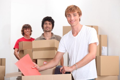 Professional movers handling fragile items in a St John’s Wood home