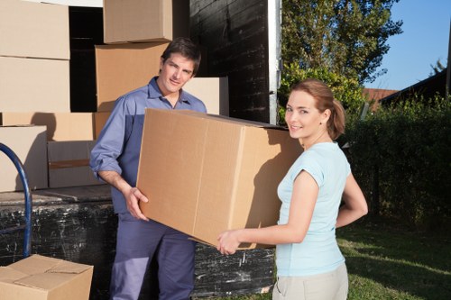 Boxes and furniture prepared for urgent removals in a London flat