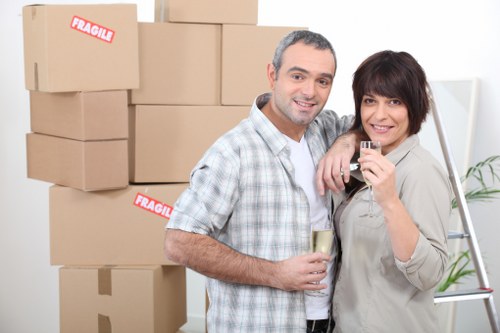 Office furniture and equipment being packed for a business move